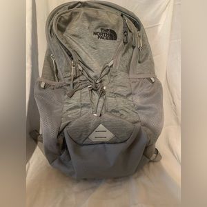 North face backpack used multiple times in high school, grey color,